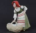 Figurin med skål, 1900-talets början