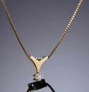 Guldhalskæde med brillant vedhæng, ca 0.07 ct., af 14 kt