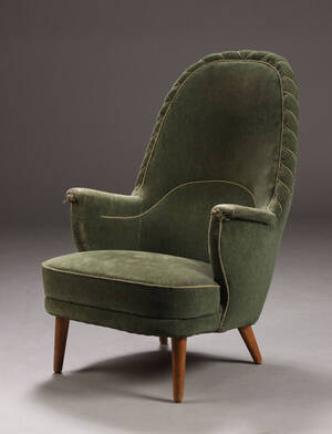 Dansk møbelproducent. Højrygget lænestol