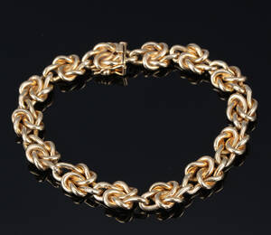 N.R. Bredehøft. Knude-armlænke af 14 kt. guld