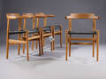 Hans J. Wegner. Sæt på fire armstole af egetræ, model PP68 
