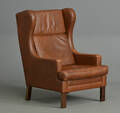 Øreklapstol med brunt læder