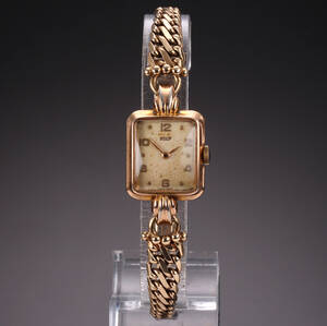 Tissot. Vintage dameur i kasse af forgyldt stål, lænke i 14kt guld, 1940erne
