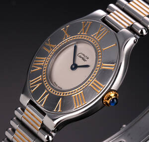 Cartier `Must de Cartier 21´. Dameur i 18 kt. guld og stål prydet med safir, 1990erne Denne vare er sat til omsalg under nyt varenummer 4073860