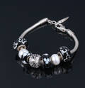 Bacio, Italien. Armbånd med 7 charms, sterlingsølv