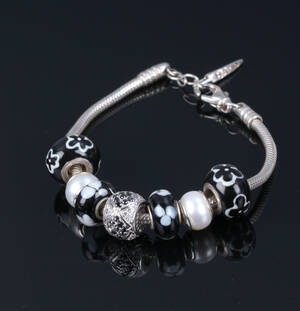 Bacio, Italien. Armbånd med 7 charms, sterlingsølv