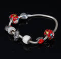 Bacio, Italien. Armbånd med 7 charms bl.a. med julemotiver, sterlingsølv