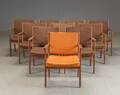 Et sæt på 10 armstole af teaktræ,  10.