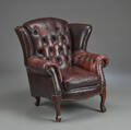 Lænestol af læder i Chesterfield stil