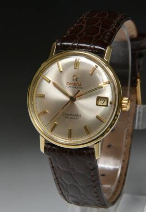Vintage Omega Seamaster de Ville herrearmbåndsur af stål med guldkappe