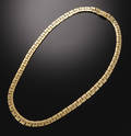 Halscollie i 18 kt guld. 
