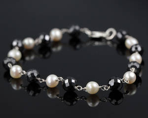 Perle og diamant armbånd.