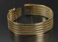 Bredt armbånd udført i 14 karats guld