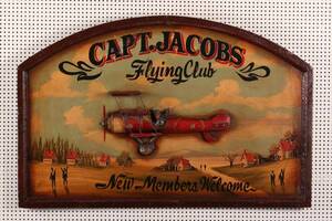 Capt. Jacobs Flying Club, træskilt