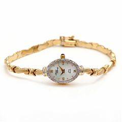 Damearmbåndsur af 14 kt. guld. Quartz. Perlemorskive.