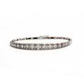 Diamantarmbånd af 18 kt. hvidguld prydet med talrige brillantslebne diamanter på i alt ca. 0.72 ct. L. ca. 18 cm. Ca. 1990.