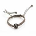 Armbånd af udvidelig snor med sølvkugle prydet med talrige rosenslebne diamanter. Indvendig diam. max ca. 9 cm. Ca. 2010.