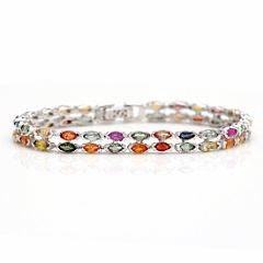 Safirarmbånd af forgyldt sølv prydet med talrige facetslebne multicolor safirer. L. ca. 16 cm. Æske medfølger. 2011.
