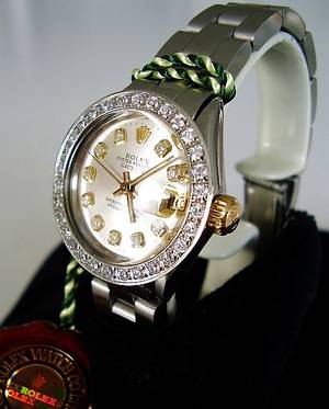 Rolex Oyster Perpetual Lady Datejust i guld og stål med diamantskive og safirlynette  ca. 0.12 og 1.10 ct. Denne auktion er annulleret2018093