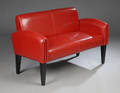 To-personers sofa af rødt læder