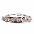 Diamantarmbånd af 18 kt. hvidguld, prydet med talrige brillant- og enkeltslebne diamanter på i alt ca. 0,80 ct. L. 15.