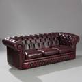 Chesterfield sofa med betræk af rødbrunt skind. 20. årh.s slutning. L. 208 cm.