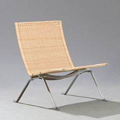 Poul Kjærholm PK-22. Hvilestol med stel af stål, sæde og ryg udspændt med flet. Udført og mærket hos Fritz Hansen, 1984.