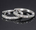 Et par creoler af 18 kt. hvidguld prydet med diamanter på i alt ca. 0.16ct