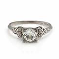 Diamantring af platin prydet med old mine-cut light yellow diamant på ca. 0.92 ct. flankeret af enkeltslebne diamanter. Klarhed VS. Str. 54. Ca. 1950.