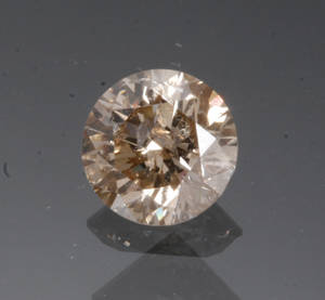 Uindfattet champagnefarvet diamant, ca. 0.80 ct.