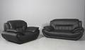 Moderne lænestol samt to-pers sofa betrukket med sort imiteret læder. 2
