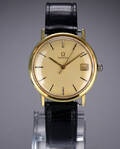 Omega. Vintage herreur i delvist forgyldt stål med gylden skive, ca. 1966