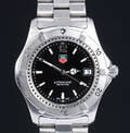 Tag Heuer Professional. Herreur i stål med sort skive med dato, 2000erne
