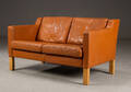 To pers sofa i cognacfarvet skind. 