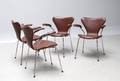 Arne Jacobsen 1902-1971. Sæt på fire armstole, model 3207 med læder