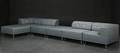 Nomad DOT Large, modul hjørnesofa betrukket lys gråt møbelstof med lyse læderknapper 
