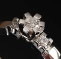 Bræmer-Jensen. Ring i 14 kt. hvidguld med tre brillantslebne diamanter i alt ca. 0,18 ct.