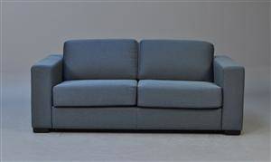 Sofa sovesofa betrukket med petroleumsfarvet møbelstof