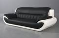 Moderne tre-pers sofa betrukket med tofarvet imiteret læder.