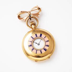 Fickur i 18 k guld med brosch i 9 k