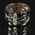 Georg Jensen. Fusion Ring i 18 kt. rød- guld- og rosaguld fattet med 8 brillanter