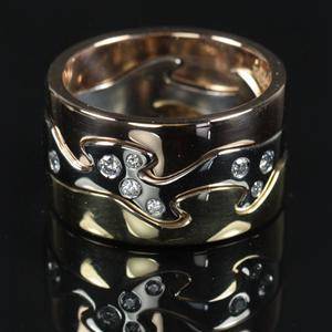 Georg Jensen. Fusion Ring i 18 kt. rød- guld- og rosaguld fattet med 8 brillanter