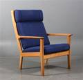Hans J. Wegner. Højryggede lænestol af eg, model GE-265