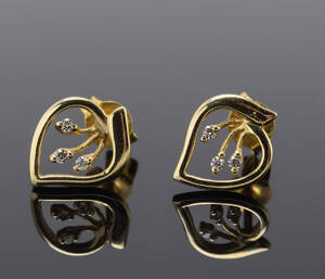 Par brillantørestikker, ca. 0.04 ct. 14 kt. guld