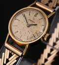 Vintage Omega damearmbåndsur, i kasse 18 karat med  lænke i 14 karat  guld 