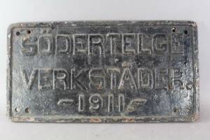 Skylt i gjutjärn Södertelges verkstäder 1911 