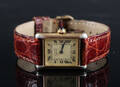 Cartier Tank. Dameur i forgyldt sterlingsølv med gylden skive