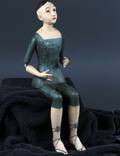 Katolsk kvindefigur i udskåret træ. 