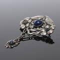  BROSCH, silver, samt cabochonslipade blå stenar, svensk importstämpel, 1900-talets första hälft.