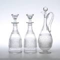  KARAFFER, 3 st, glas, varav en med slipad dekor av rosor, omkring 1900.